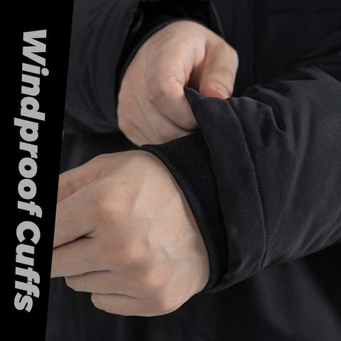 Close-up of a person adjusting a black jacket with windproof cuffs, with text on the left side.
